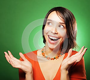 Young expression woman over green background