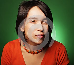 Young expression woman over green background