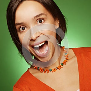 Young expression woman over green background