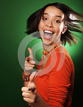 Young expression woman over green background