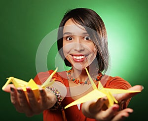 Young expression woman with paper bird