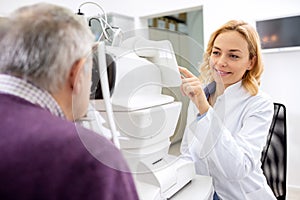 Young eye doctor work using apparatus in eye ambulance