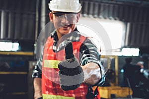 Young factory job worker or engineer close up portrait in manufacturing factory