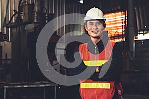 Young factory job worker or engineer close up portrait in manufacturing factory