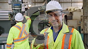 Young factory worker or engineer close up portrait in factory