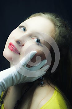 Young fairhaired blueeyed girl on black background