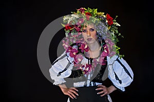 Young fairy woman with flowers on her head