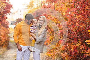 Young family on an autumn walk