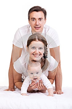 Young family with baby boy over white