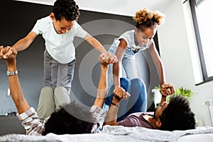 Young family being playful and spending fun time together at home