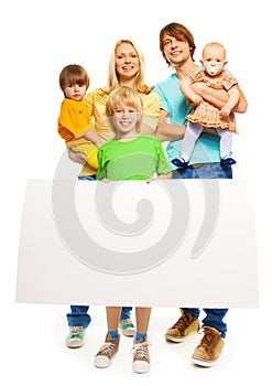 Young family with blank advertising banner