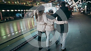 The young family came to the amusement park to rest.