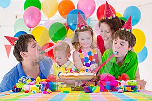 Young family celebrating birthday party