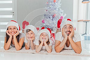 Young family celebrating Christmas at home.Happy young family enjoying their holiday time together
