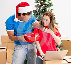 Young family celebrating christmas in new home