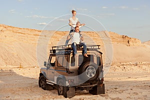 Young family with a child in the desert.