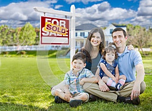 Young Family With Children In Front of Custom Home and Sold For