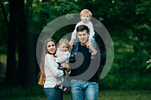 Young family with children, Happy father, mother and two sons spending time