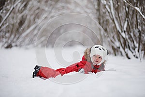 Young family with children are walking in the winter park. Winte