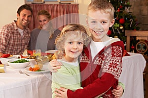 Young family at Christmas dinner table