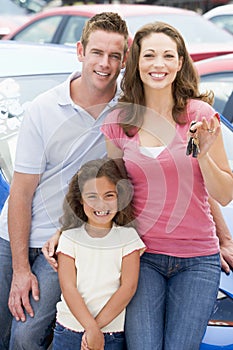 Young family collecting new car