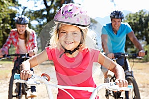 Young family on country bike ride