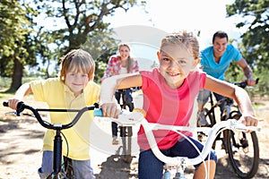 Young family on country bike ride