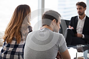 Young couple, family at meeting with psychologist counselor