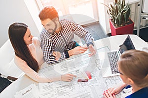 Young family couple purchase rent property real estate . Agent giving consultation to man and woman. Signing contract