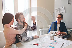 Young family couple purchase rent property real estate . Agent giving consultation to man and woman. Signing contract