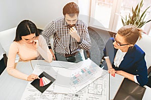 Young family couple purchase rent property real estate . Agent giving consultation to man and woman. Signing contract