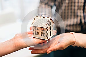 Young family couple purchase rent property real estate . Agent giving consultation to man and woman. Signing contract