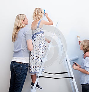 Young Family decorating their new home