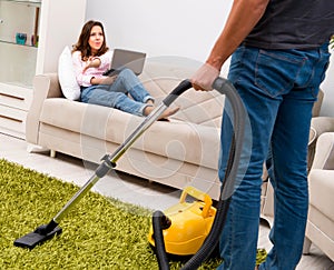 Young family doing cleaning at home