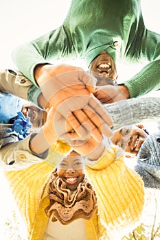 Young family doing a head circles and joining their hands