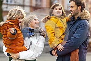 Young family enjoying their day in a city