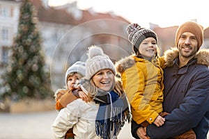 Young family enjoying their day in a city during Christmas