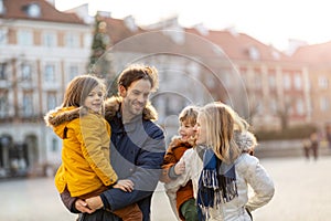 Young family enjoying their day in a city during Christmas