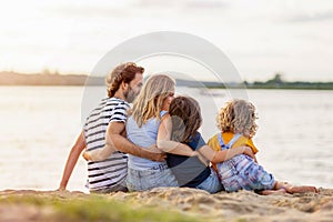 Young family enjoying time at the beach