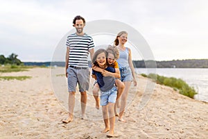 Young family enjoying time at the beach