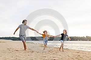 Young family enjoying time at the beach