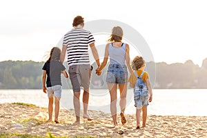 Young family enjoying time at the beach