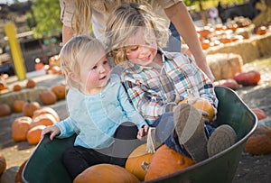 Young Family Enjoys a Day at the Pumpkin Patch