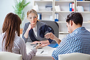 The young family filing divorce papers with lawyer