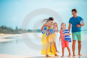 Young family of four on beach vacation