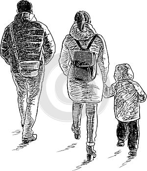 A young family goes on a walk