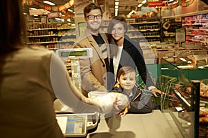 Young family in grocery store