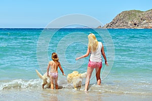 Young family having fun on the beach