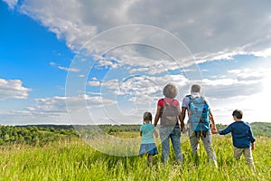 Young family hiking on mountain