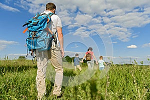 Young family hiking on mountain